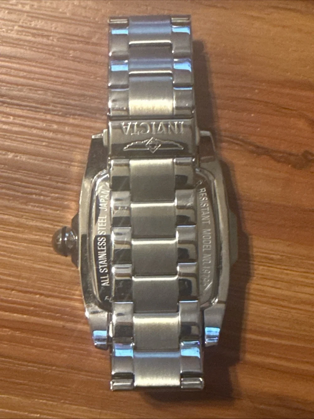 Watch on wooden surface